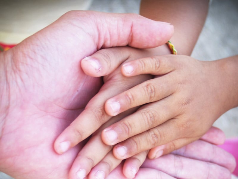 Childs Hands On Adult Hands Representing Child Custody